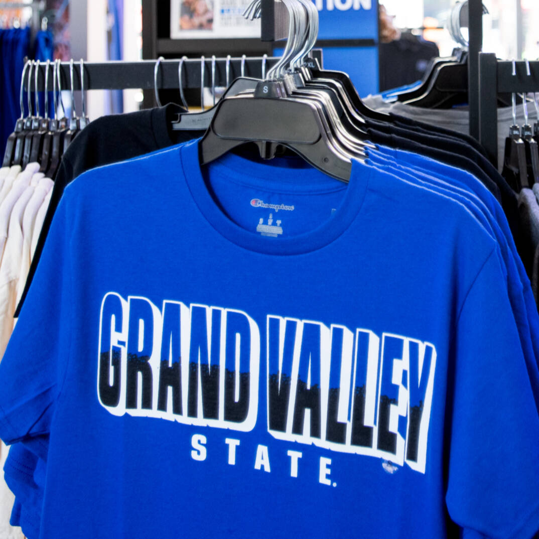 View of clothing racks inside a store.